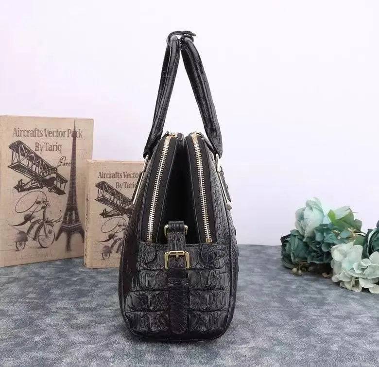 Black crocodile leather briefcase handbag by Rossie Viren with shell style design and textured crocodile pattern.