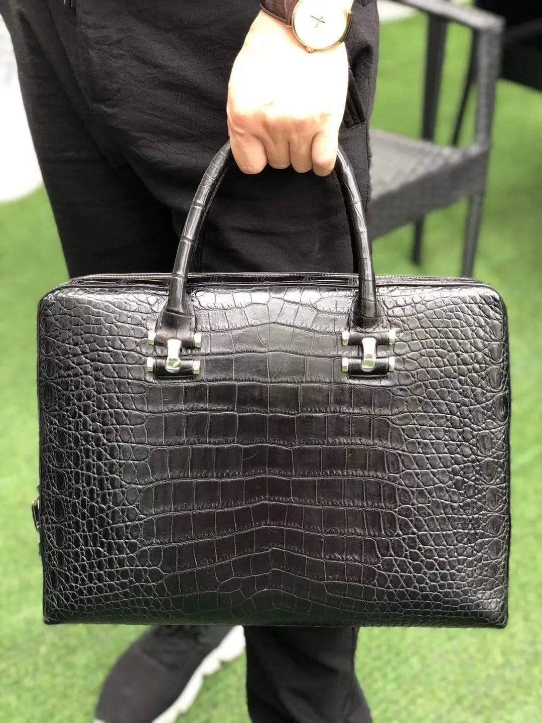 Black genuine crocodile leather briefcase by Rossie Viren with side password lock and sleek, professional design.