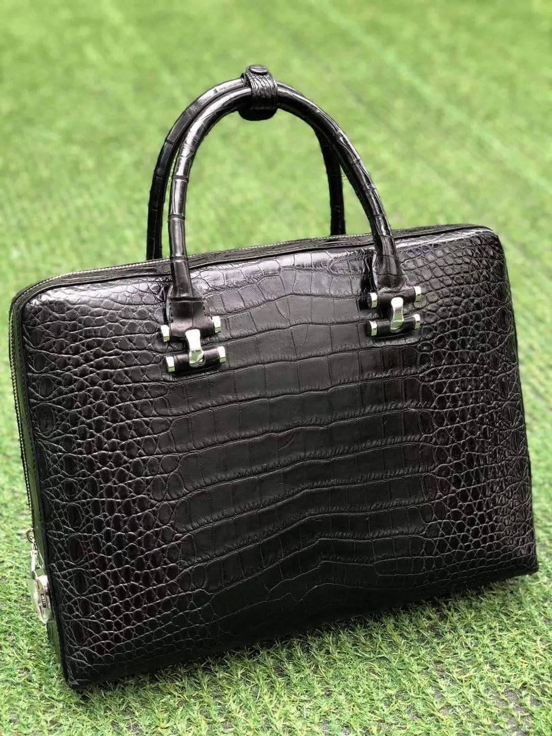 Black genuine crocodile leather briefcase by Rossie Viren with side password lock and sleek, professional design.
