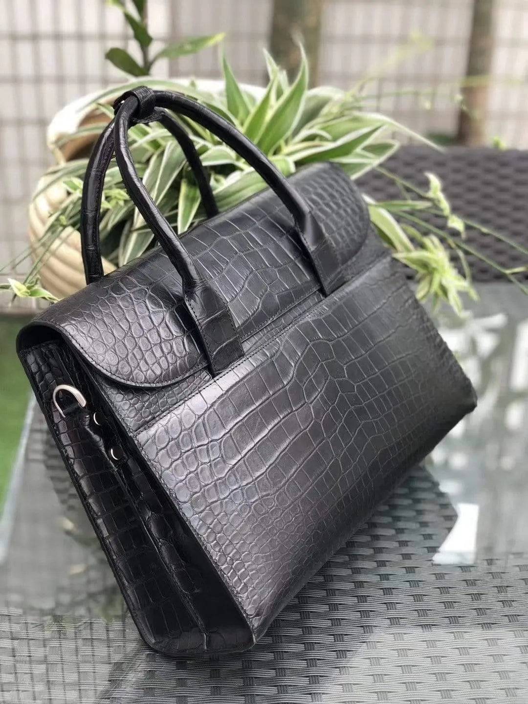 Black genuine crocodile leather foldover briefcase by Rossie Viren, showcasing textured crocodile skin and sleek design.