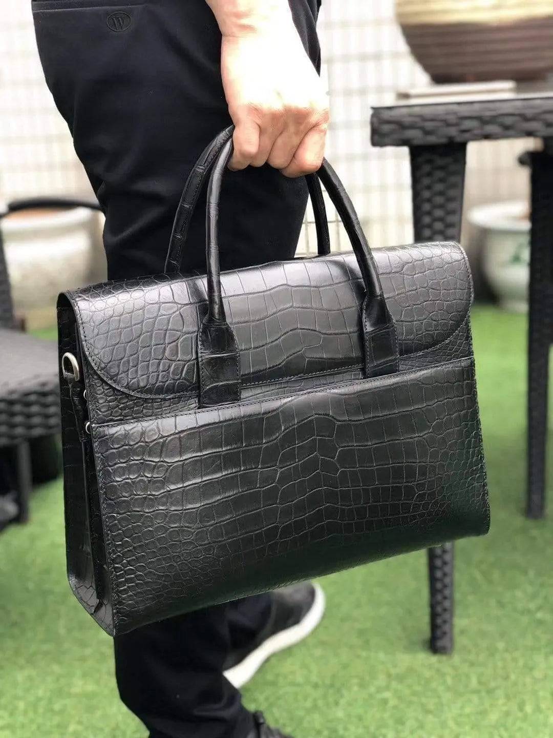 Black genuine crocodile leather foldover briefcase by Rossie Viren, featuring a sleek textured crocodile pattern and classic design.