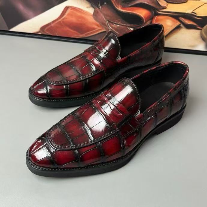Vintage red crocodile leather loafer shoes by Rossie Viren, showcasing the textured crocodile skin and classic slip-on design.