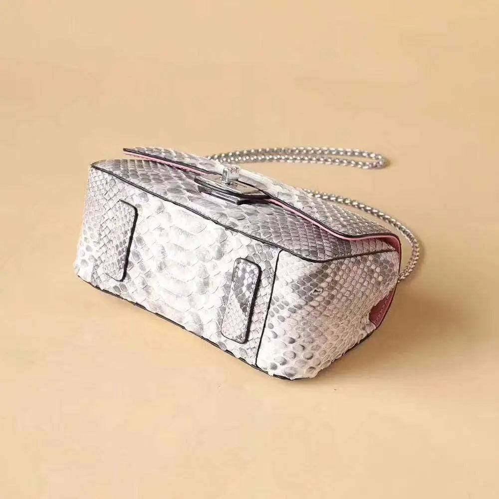 Grey Rossie Viren women's genuine python leather crossbody handbag with double flap and chain detail.