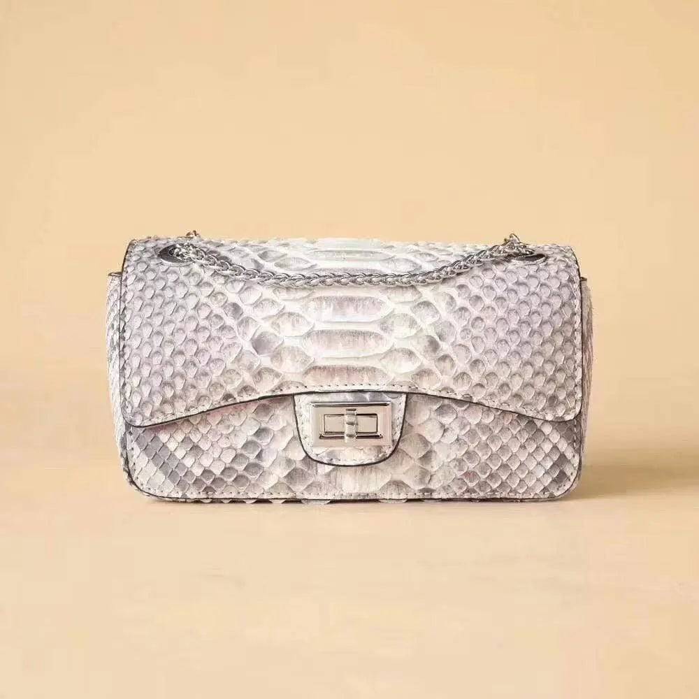 Grey Rossie Viren Python leather crossbody handbag with double flap and chain detail.