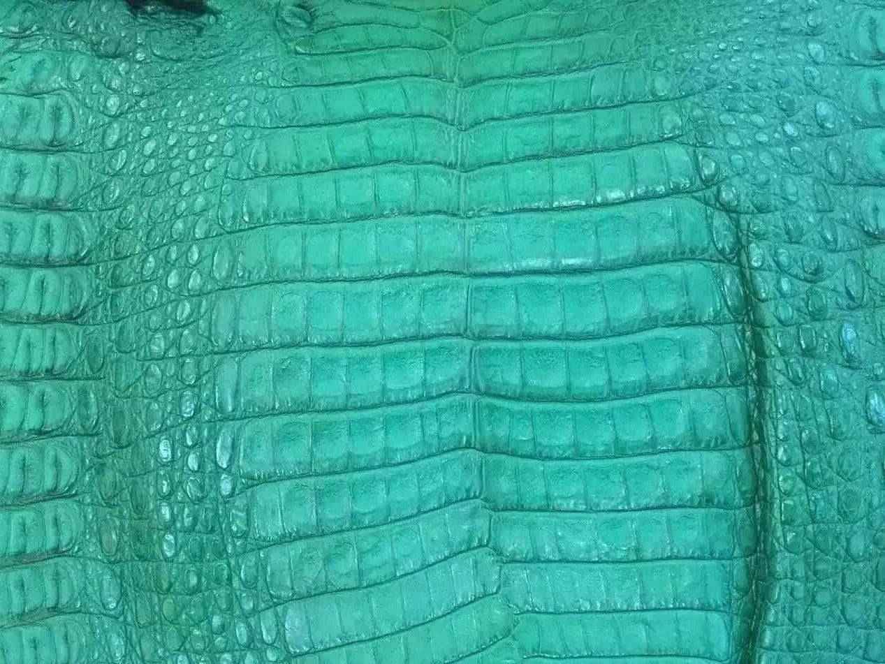 Crocodile skin belly leather in vibrant colorway, showcasing textured exotic leather for handbags and belts by Rossieviren.