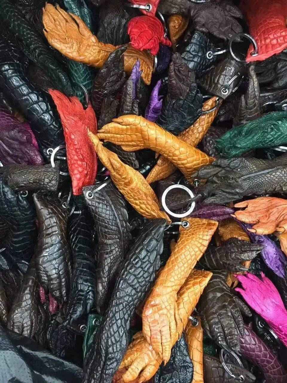Rossie Viren crocodile skin key holder with gold-tone clasp and multiple key rings, showcasing luxurious textured crocodile leather.