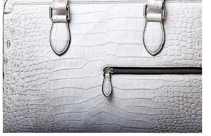 White crocodile belly leather briefcase handbag by Rossie Viren, featuring a textured crocodile pattern and sleek design.