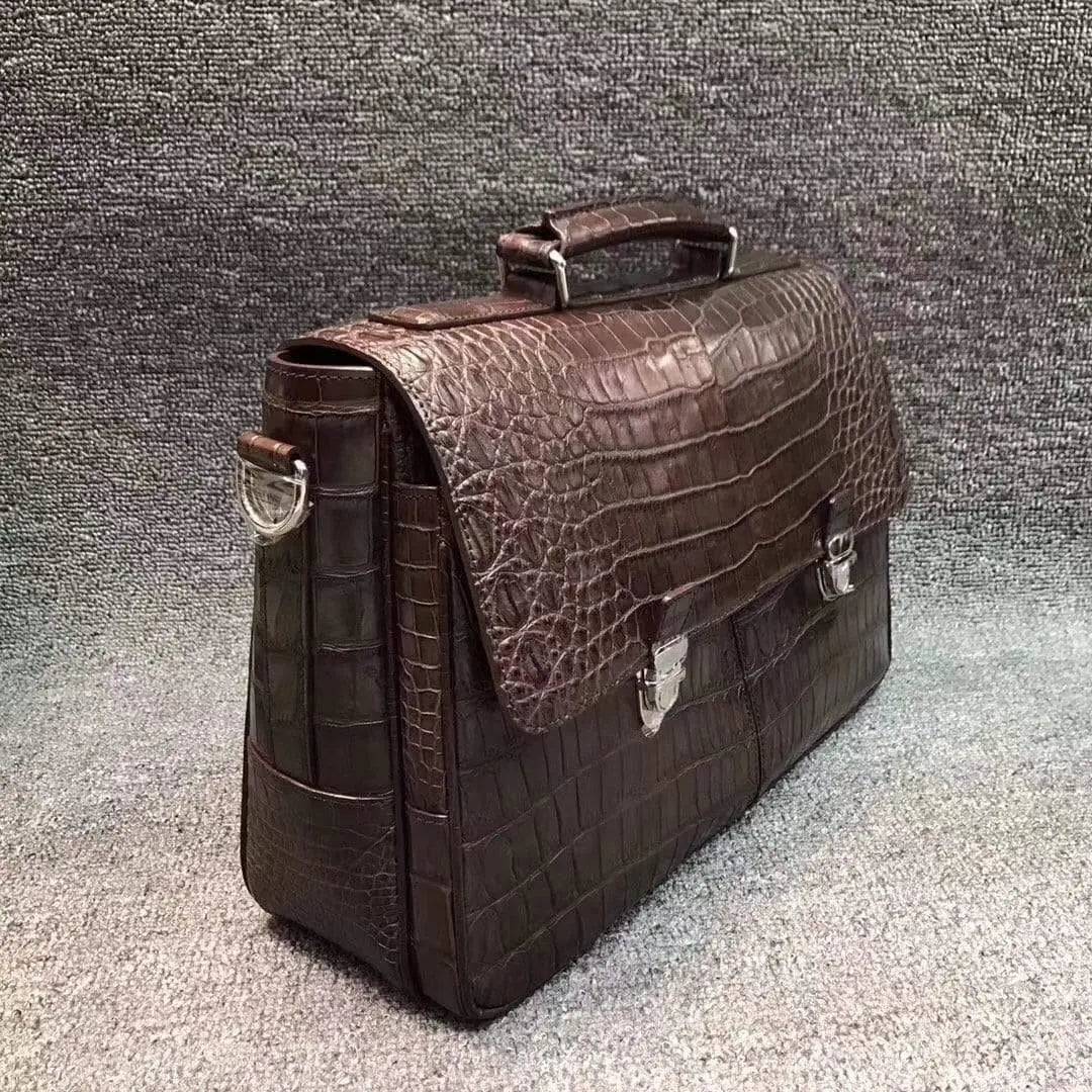 Rossie Viren crocodile belly leather lock briefcase handbag with sleek design and sturdy handles.
