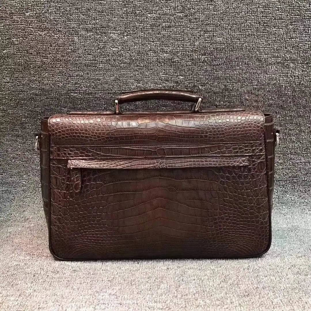 Rossie Viren crocodile belly leather lock briefcase handbag with sleek design and sturdy handle.