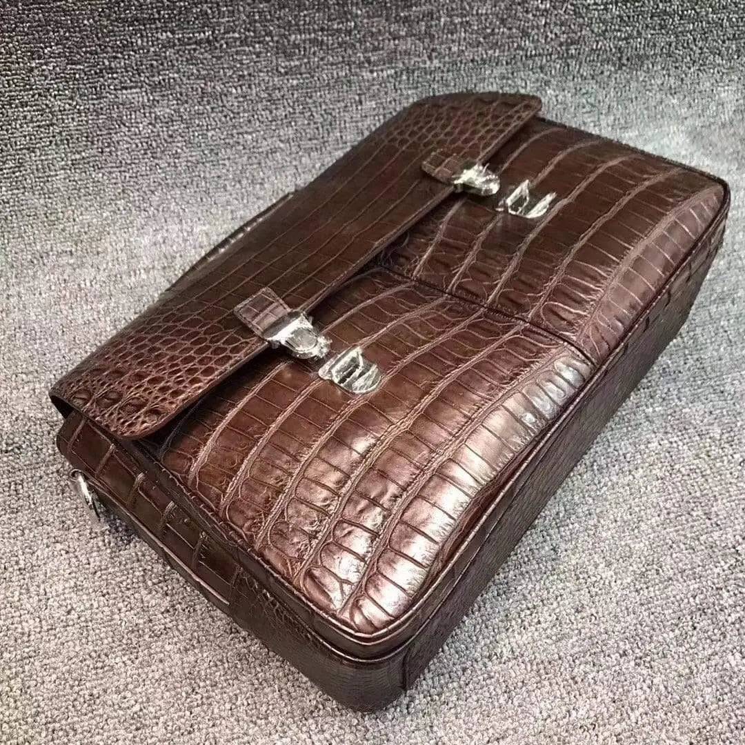 Rossie Viren crocodile belly leather lock briefcase handbag with sleek design and textured crocodile pattern.