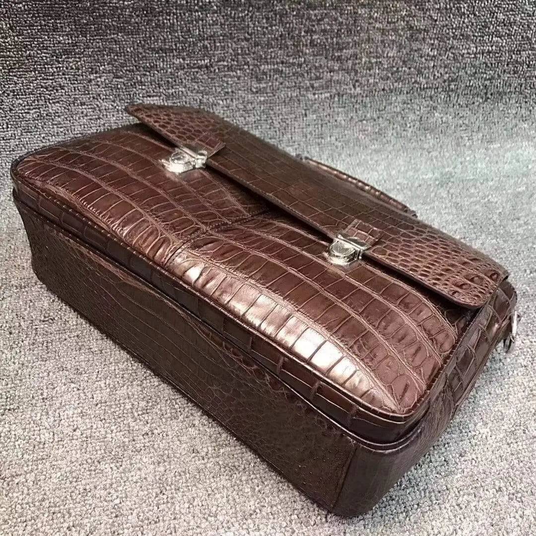 Rossie Viren crocodile belly leather lock briefcase handbag with a textured crocodile pattern and secure clasp closure.