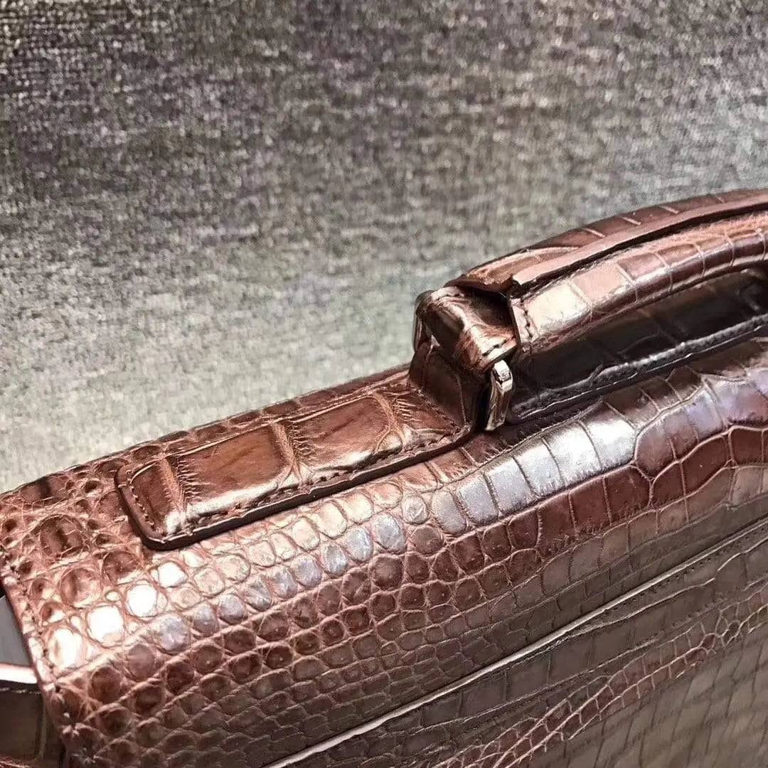 Rossie Viren crocodile belly leather lock briefcase handbag with textured crocodile pattern and elegant design.
