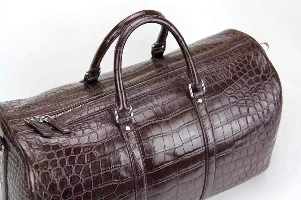 Rossie Viren crocodile belly leather travel duffel bag, super medium size, with sturdy handles and textured crocodile pattern.