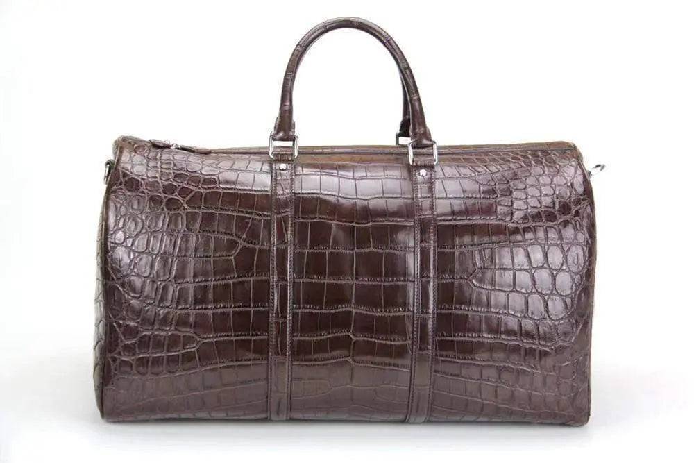 Rossie Viren crocodile belly small travel duffel bag, handbag style with textured crocodile pattern and sturdy handles.