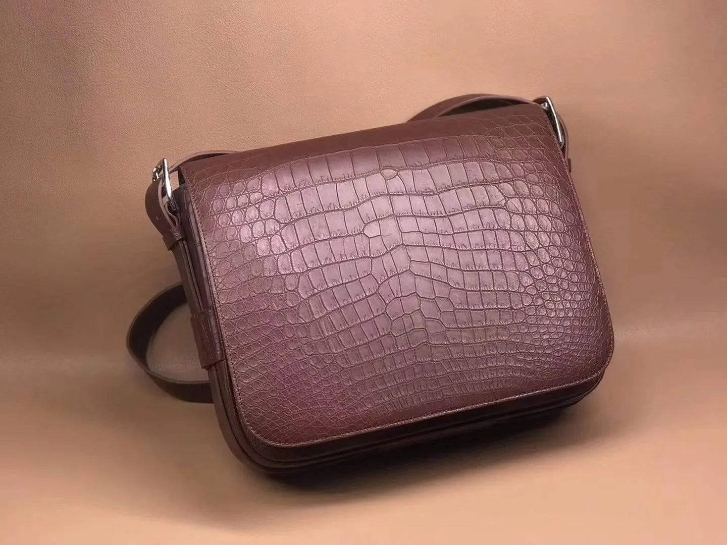 Rossie Viren crocodile garment leather medium messenger bag, soft handbag with adjustable strap and structured design.