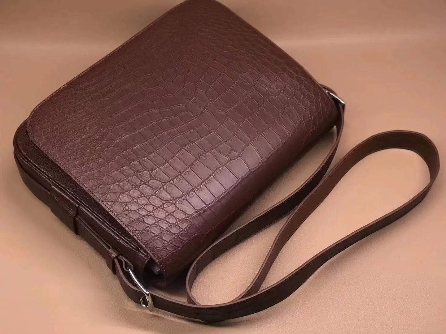 Rossie Viren crocodile garment leather medium messenger bag with soft texture, featuring a sleek handbag design and adjustable strap.