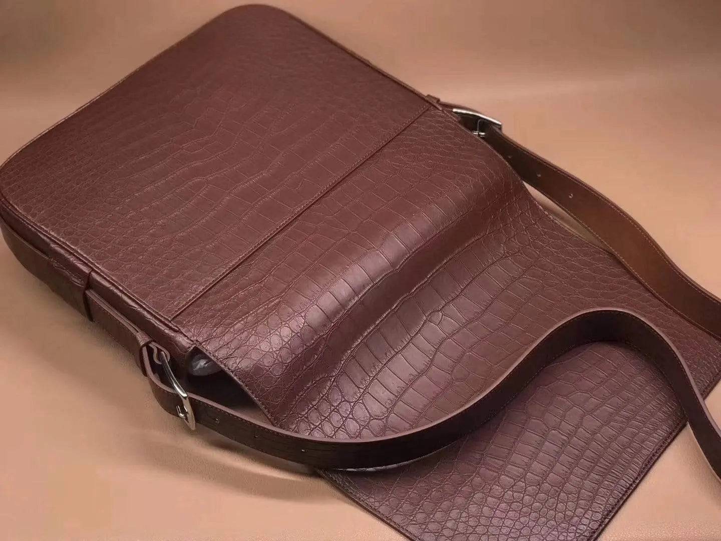 Rossie Viren crocodile-garment leather medium messenger bag showing soft texture and structured handbag design.