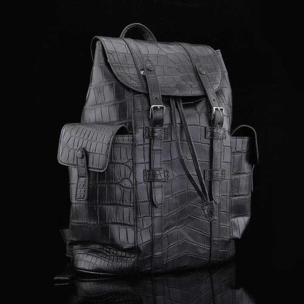 Black crocodile leather backpack from Rossie Viren featuring textured crocodile skin and adjustable shoulder straps.