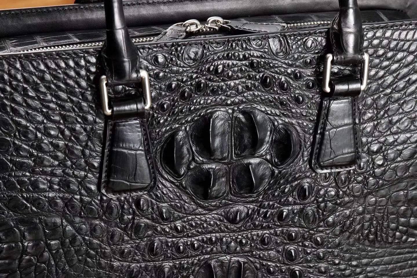 Rossie Viren crocodile leather briefcase handbag with sturdy handles and sleek design, perfect for professional use.