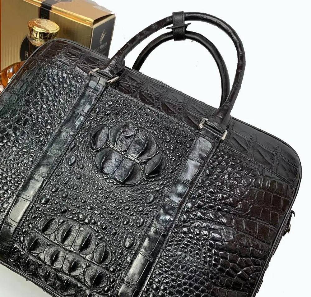 Large crocodile leather briefcase handbag by Rossie Viren, featuring a structured design and top handles.