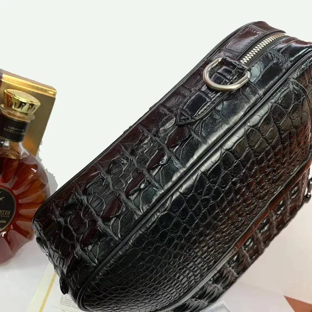 Large crocodile leather briefcase handbag by Rossie Viren, showcasing textured crocodile pattern and sturdy handles.