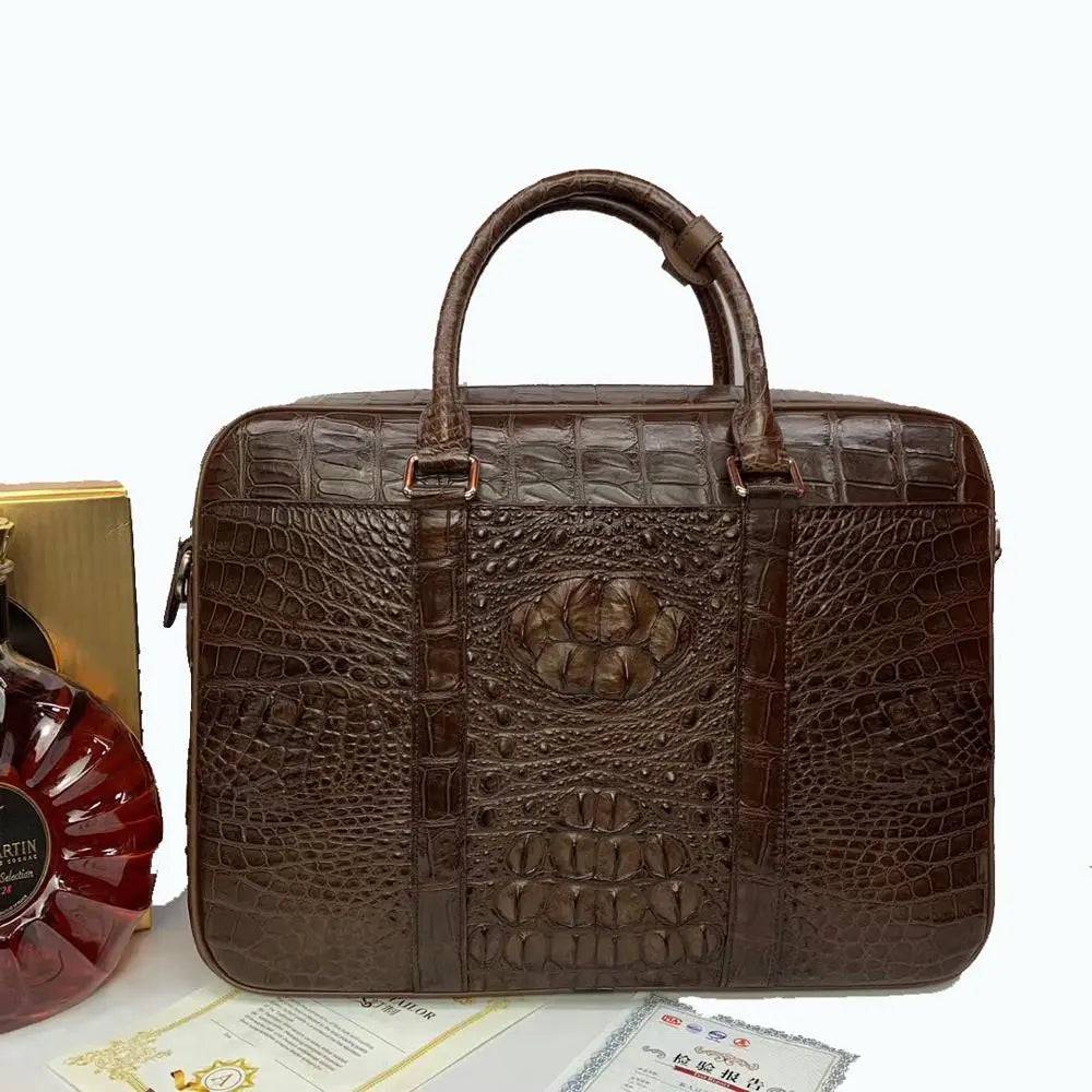 Large crocodile leather briefcase handbag by Rossie Viren, featuring a sleek, textured exterior and sturdy handles.