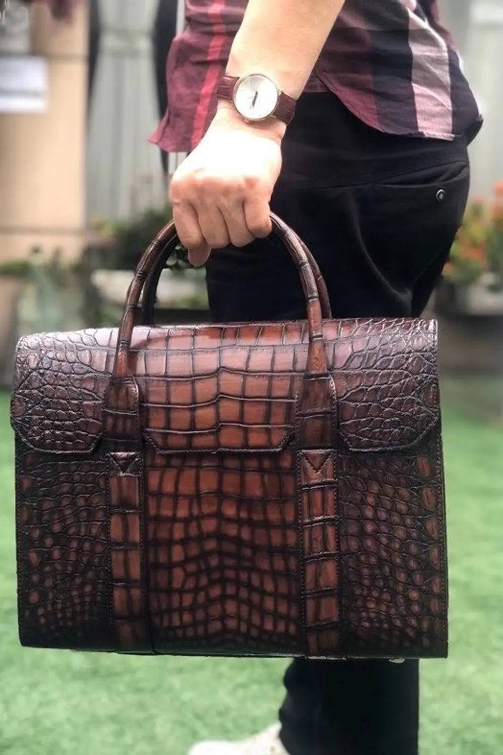 Vintage brown crocodile leather briefcase handbag by Rossie Viren, featuring textured surface and sturdy handle.