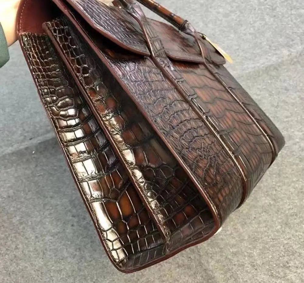 Vintage brown crocodile leather briefcase handbag by Rossie Viren with textured crocodile pattern and sturdy handles.