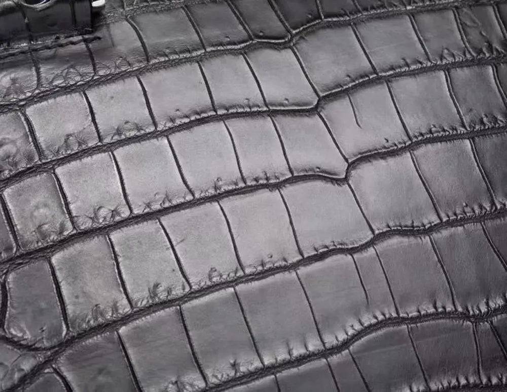 Crocodile leather briefcase for men with shoulder strap, messenger style, featuring a password lock and business-ready design.