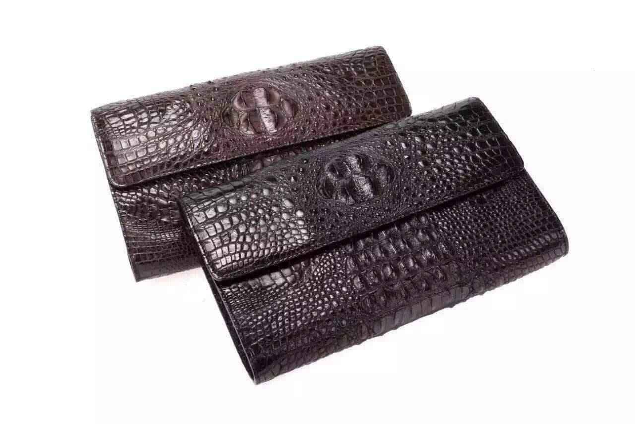 Crocodile leather clutch shoulder bag for men by Rossie Viren, featuring a sleek design and textured crocodile pattern.