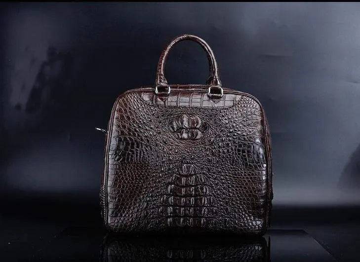 Brown crocodile leather duffel travel bag by Rossie Viren with sturdy handles and spacious interior for travel essentials.