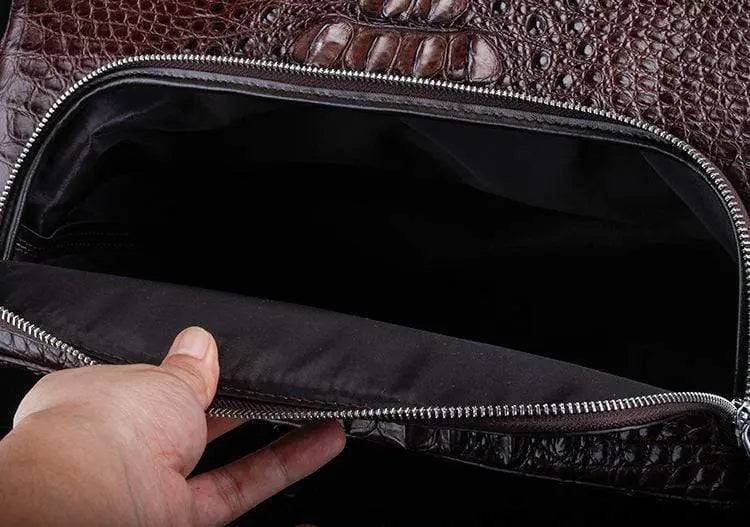 Brown crocodile leather duffel travel bag by Rossie Viren, showcasing a spacious handbag with textured crocodile pattern.