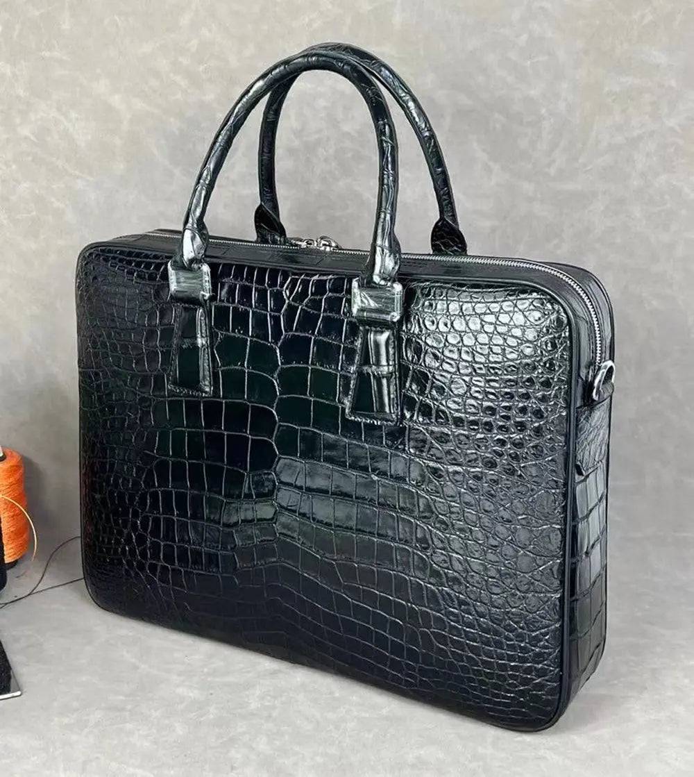 Rossie Viren crocodile leather laptop briefcase with combination lock, featuring a sleek handbag design and textured crocodile pattern.
