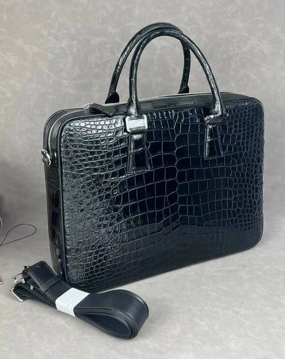 Rossie Viren crocodile leather laptop briefcase with a secure combination lock, featuring a sleek, professional handbag design.