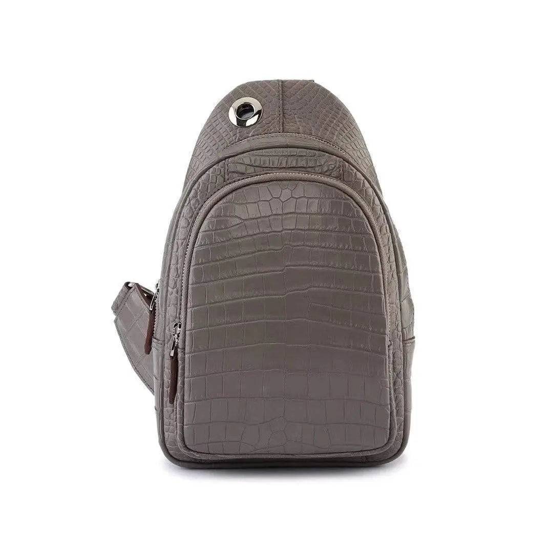 Crocodile leather men's sling chest bag by Rossie Viren, featuring a messenger style shoulder handbag for travel and hiking.
