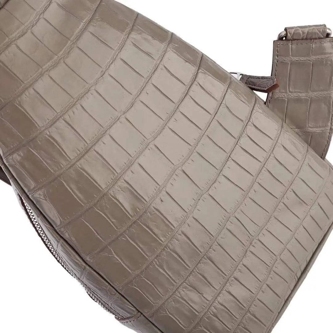 Crocodile leather men's sling chest bag by Rossie Viren featuring a compact messenger style for travel and hiking.