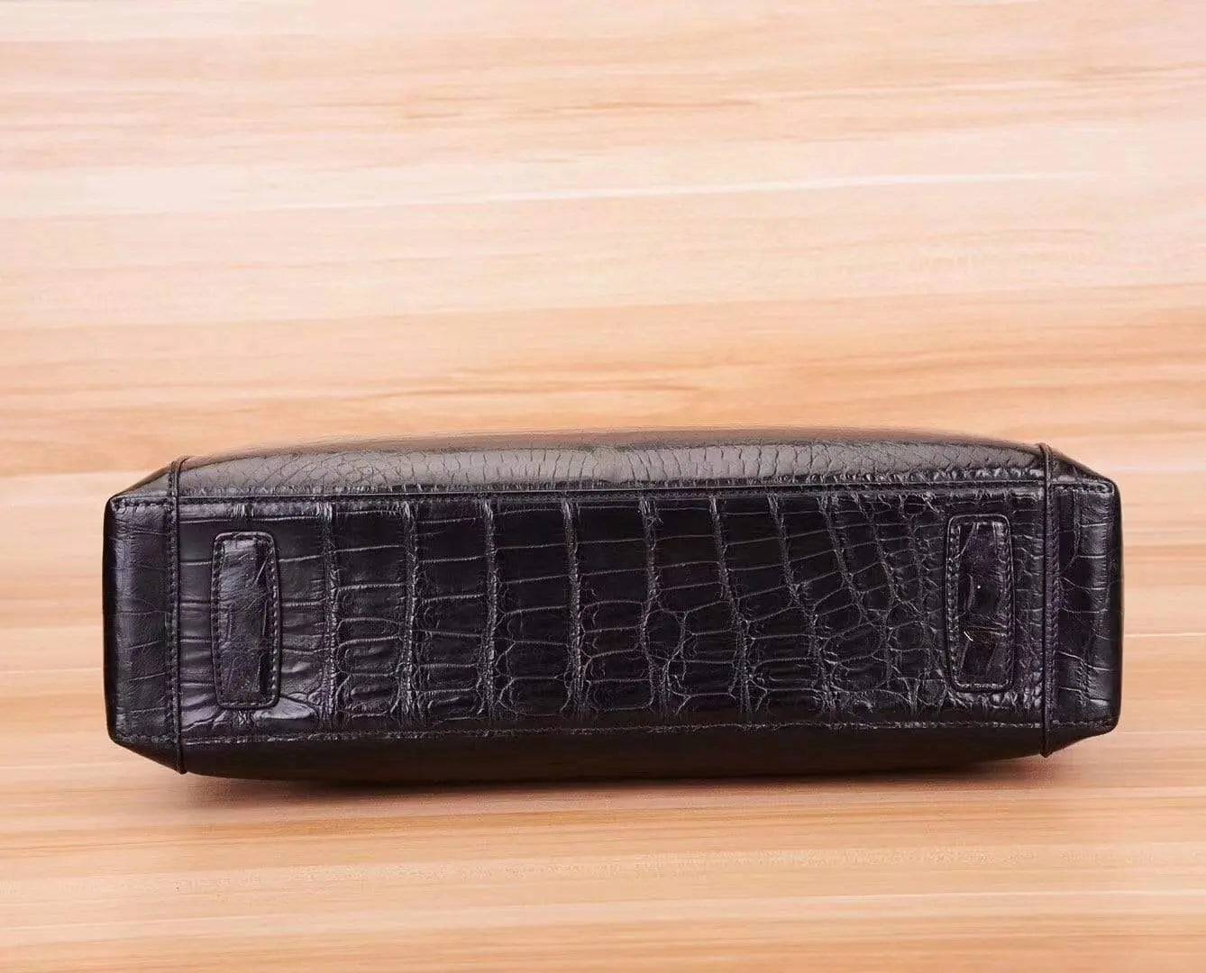 Black crocodile and alligator men's briefcase shoulder bag by Rossie Viren, featuring textured leather and sturdy shoulder strap.