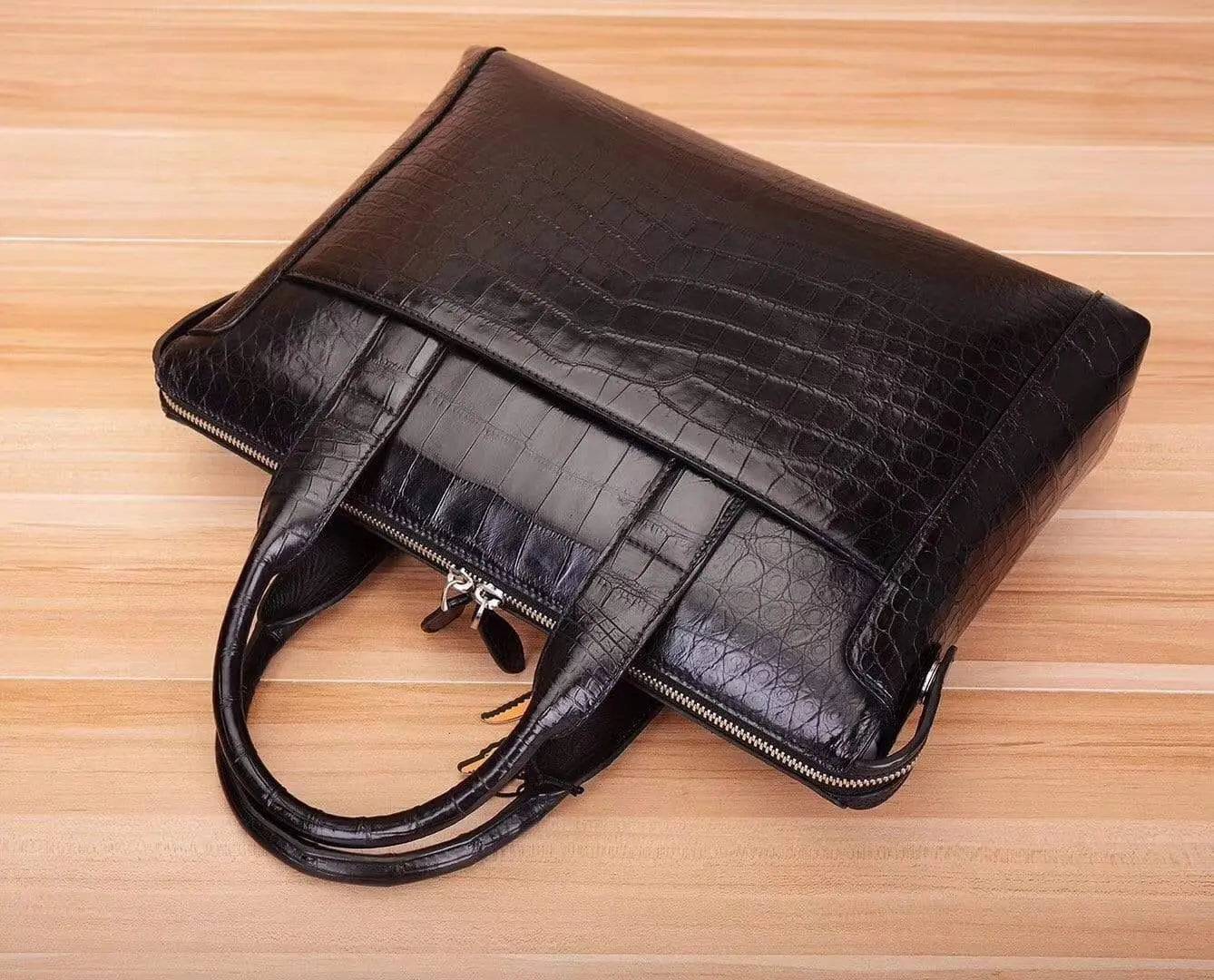 Black crocodile and alligator men's briefcase shoulder bag by Rossie Viren with textured leather finish and adjustable shoulder strap.