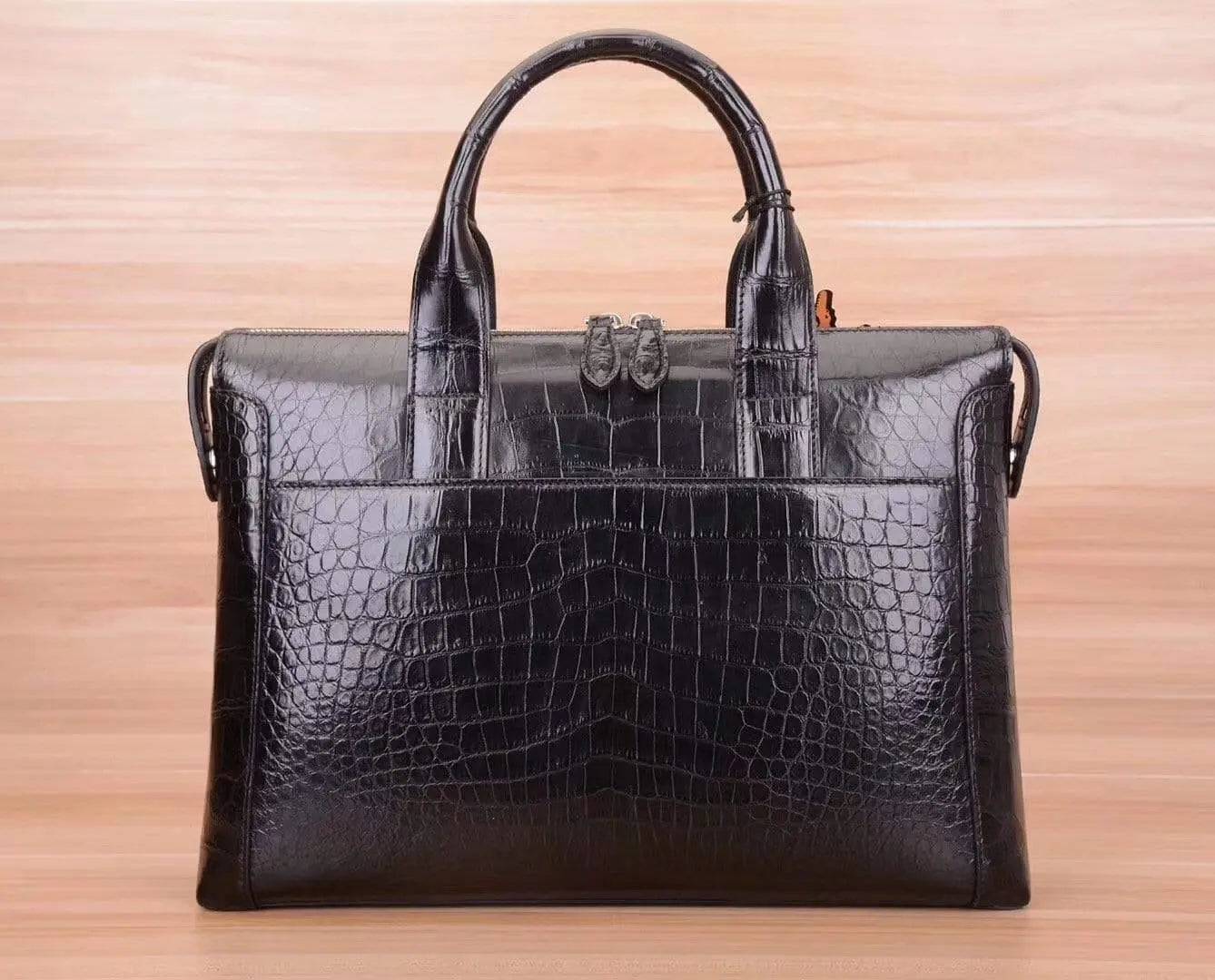 Black crocodile and alligator men's briefcase shoulder bag by Rossie Viren, featuring a sleek, textured leather design with sturdy handles.