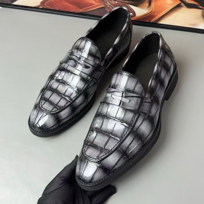 Vintage grey crocodile leather loafer shoes by Rossie Viren, showcasing a classic design and textured crocodile pattern.