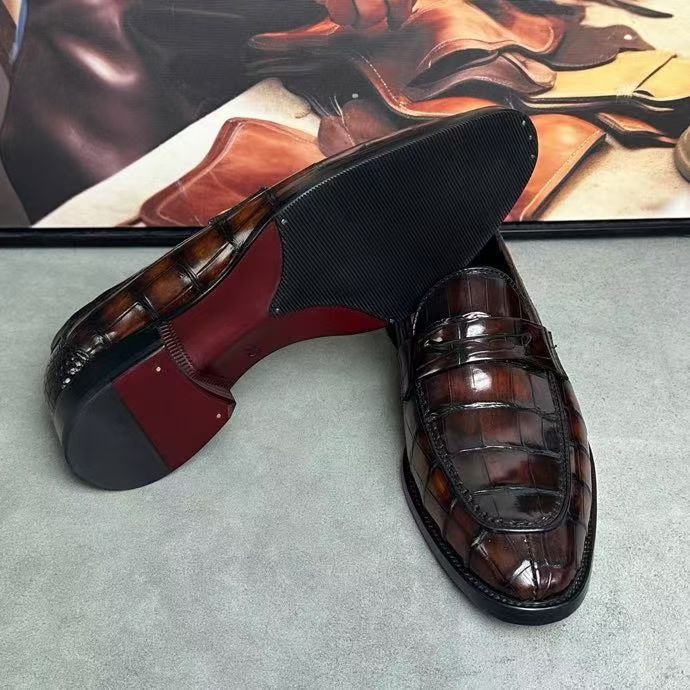Vintage brown crocodile leather loafer shoes by Rossie Viren, showcasing textured crocodile pattern and classic slip-on design.