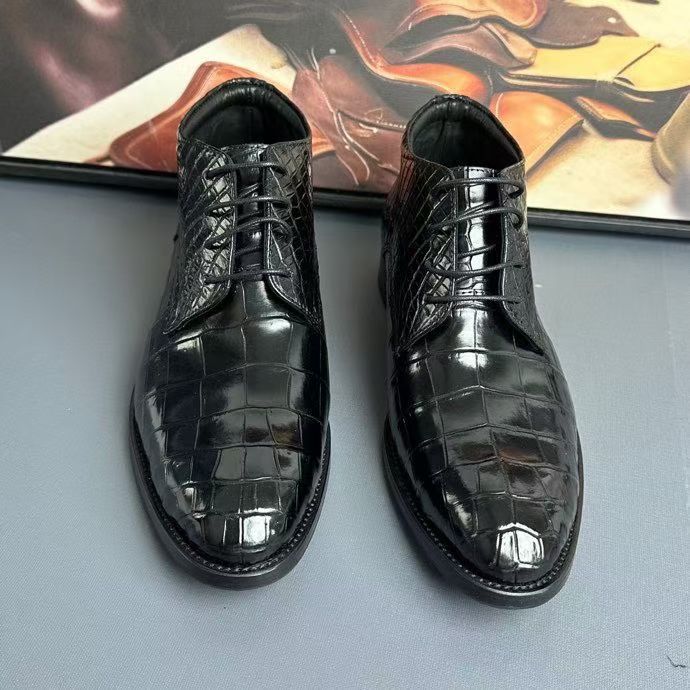 Black genuine crocodile leather boots by Rossie Viren, stylish shoes with textured crocodile pattern and polished finish.