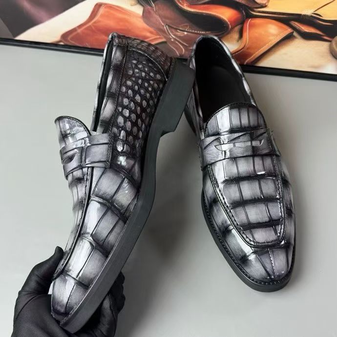 Vintage grey crocodile leather loafer shoes by Rossie Viren, showcasing the textured crocodile pattern and classic slip-on style.