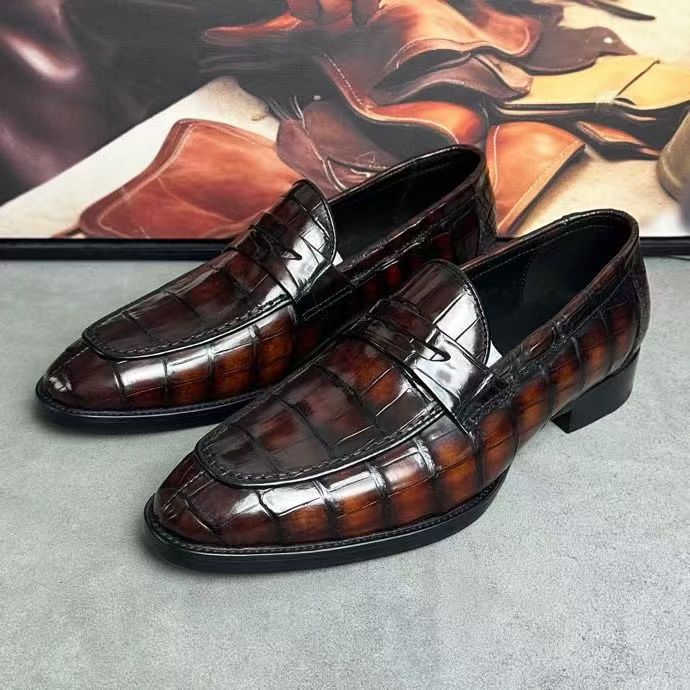 Vintage brown crocodile leather loafer shoes by Rossie Viren, featuring detailed crocodile skin texture and classic slip-on design.