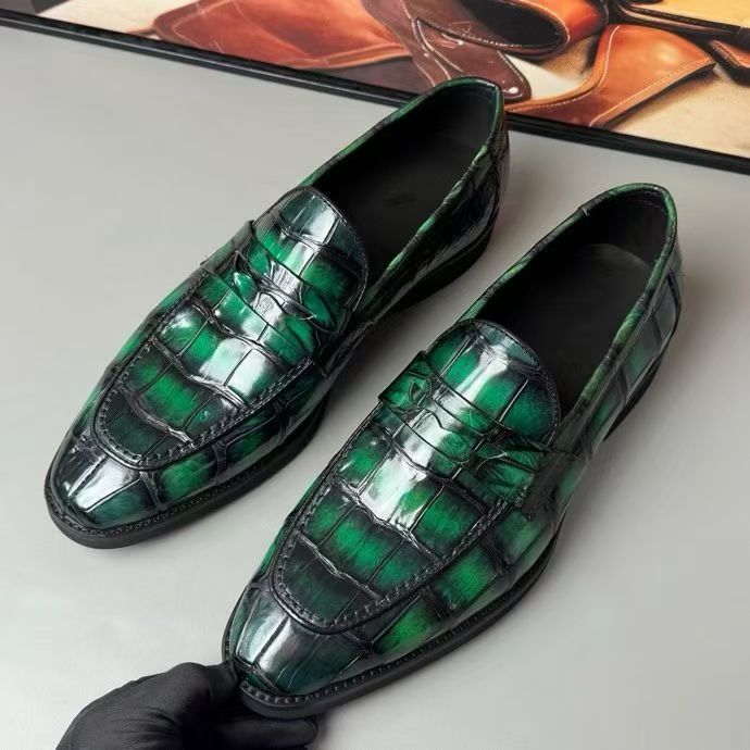 Vintage green crocodile leather loafer shoes by Rossie Viren, featuring textured crocodile pattern and classic slip-on style.