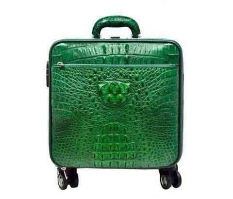 Genuine crocodile luxury luggage roller bag by Rossie Viren with sleek design and sturdy handle for travel.