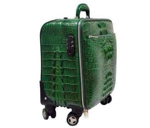 Genuine crocodile leather luxury luggage roller bag with sleek design and sturdy handle, by Rossie Viren.