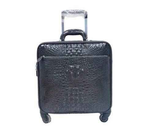Genuine crocodile luxury luggage roller bag with polished finish, featuring sturdy handles and spacious interior for travel.
