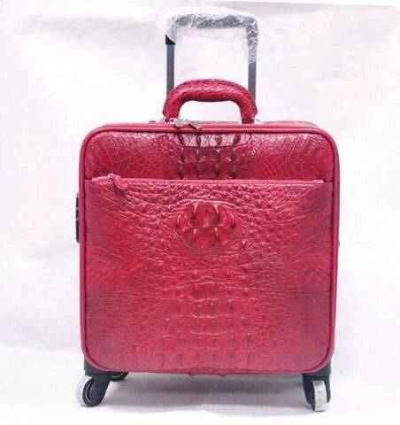 Genuine crocodile leather luxury luggage roller bag by Rossie Viren with sleek design and sturdy handle for travel.