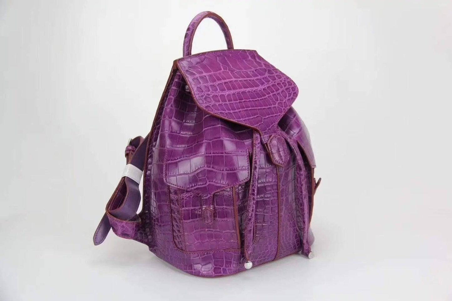 Genuine crocodile belly leather backpack handbag by Rossie Viren, featuring a textured crocodile pattern and sleek design.